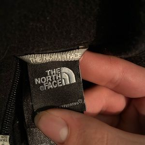 A black north face quarter zip fleece